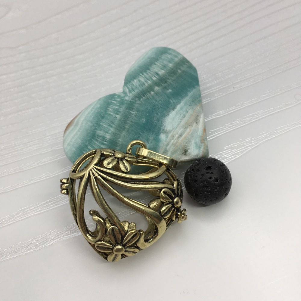 Heart & Flower Aromatherapy Brass tone Locket.  Lava stone included.